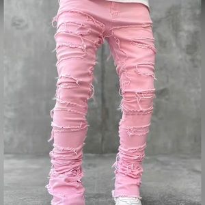 Pink shredded flare jeans